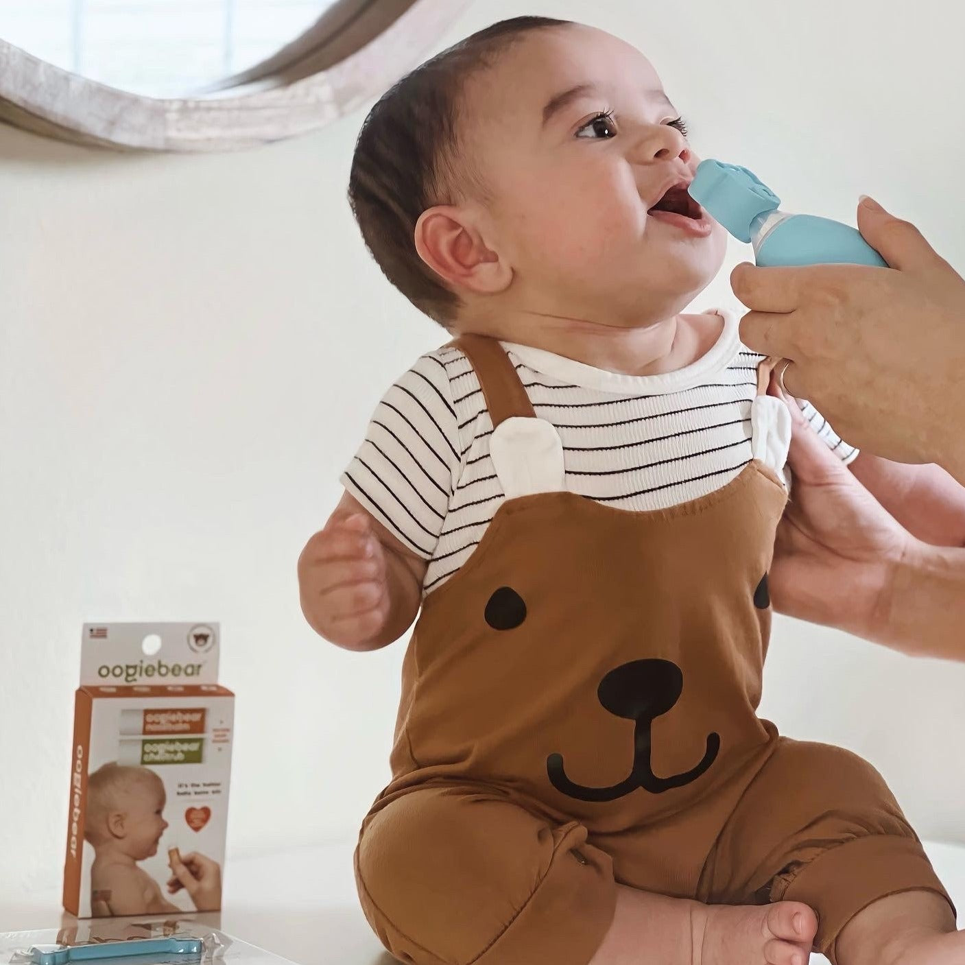 baby with oogiebear bulb aspirator